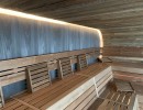 image sauna éclairage banc lattes panneau en bois profil bois assemblage construction installation bien-être mer temps piscine à vagues u spa buesum feu glace sauna groupe
