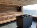 image sauna poêle kw banc lattes panneau de bois profil fenêtre en bois installation installation de construction bien-être temps de la mer piscine à vagues u spa buesum feu glace sauna groupe