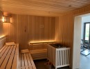 photo finnish sauna wooden benches lighting plant construction plant planning wellness spa furniture loungers sauna project tannenhof hotel feldberg fire and ice wellness spa group gmbh